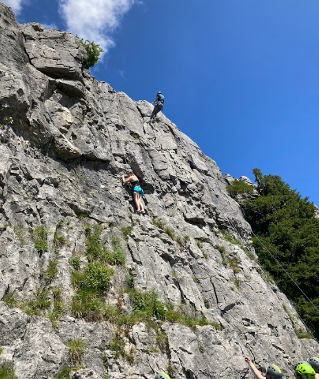Wide shot of students climbing Twisledon Scar limestone cliffs near Ingleton in the North Yorkshire Dales at the CCF 2024 Training Camp.