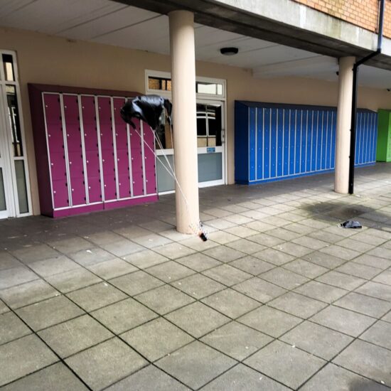 Egg being parachuted to the group using a science experiment.