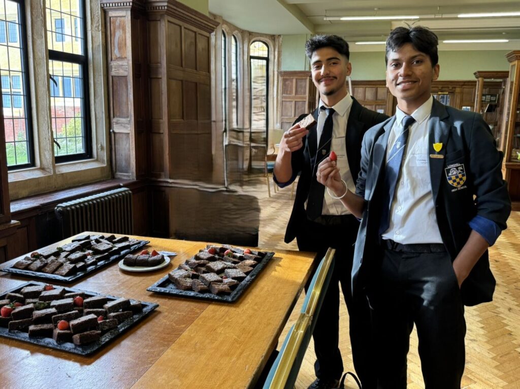 Two students in the dinning room of Roedean School, enjoying the snacks on offer.