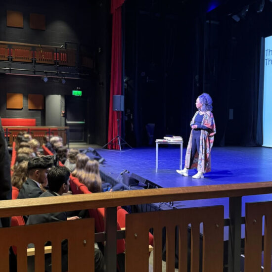 Photo Carolyn Bain at Roedean School giving a talk during Black History Month