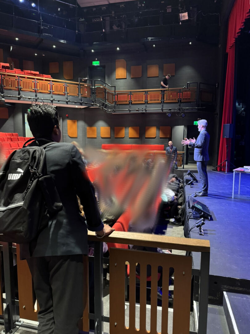 Longhill High School student observing the talk from the gallery.