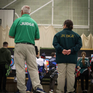 Picture of two judges looking at the contestants.