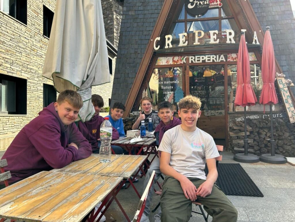 Longhill High School Students sitting outside a Creperia in Androrra