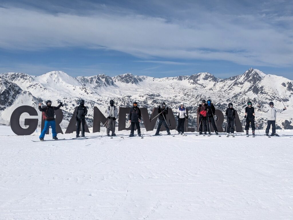 Longhill High School group posing for a photo outside the ski resort in Androrra