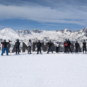 Longhill High School group posing for a photo outside the ski resort in Androrra