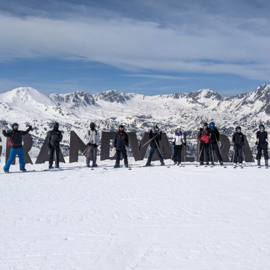 Longhill High School group posing for a photo outside the ski resort in Androrra