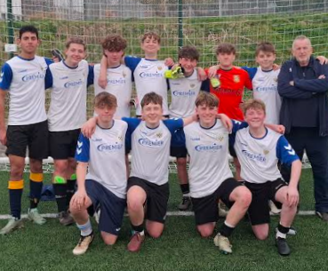 Year 10 boys football team photo with Mr Rolf
