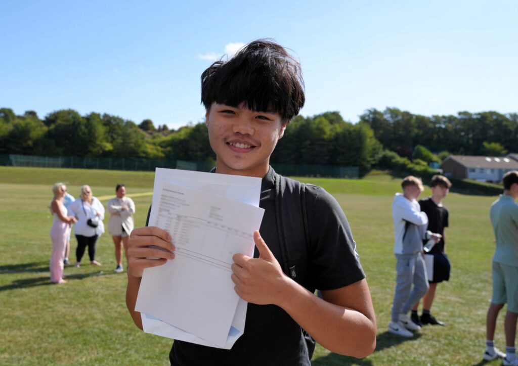 Student holding results