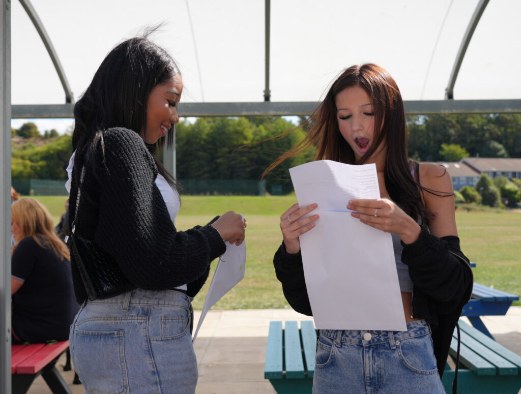 Two students reviewing their results