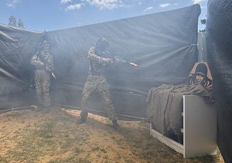 CCF cadet holding a rifle
