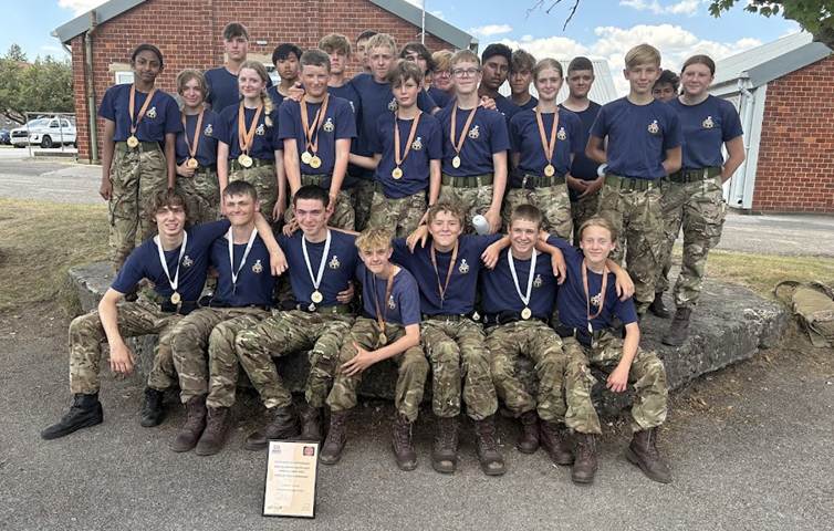 Longhill CCF receiving medals for their efforts