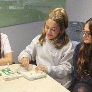 Group photo of students working on a practical task.