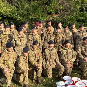 CCF Staff and Students posing for a photo in their uniform at the Rottingdean Memorial Garden