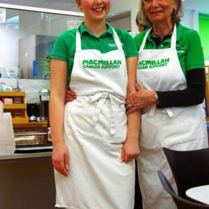 Student posing with cafe worker.