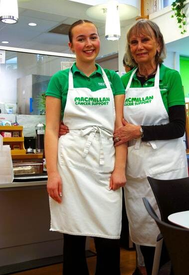Student posing with cafe worker.