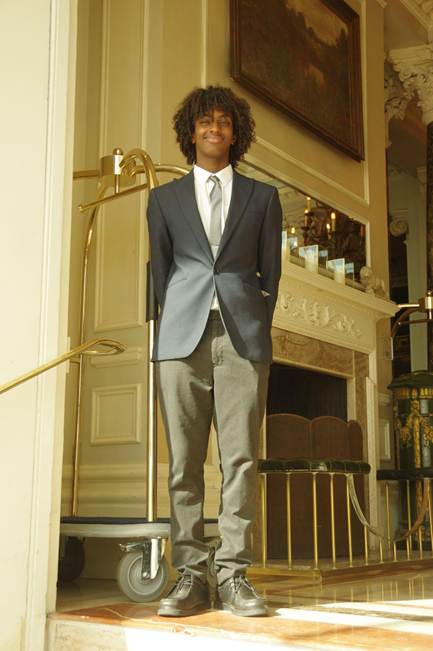 Student in hotel posing for a photo
