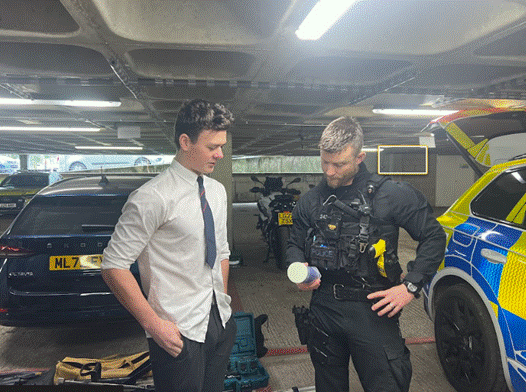 Student analysing Police equipment in the Station Car Park