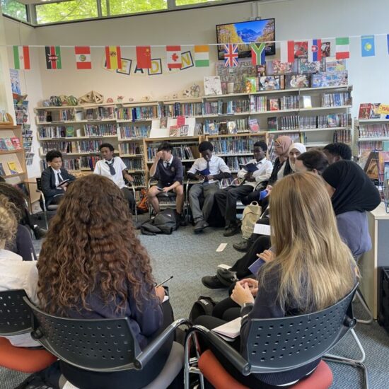 Students sat around a circle in the school library