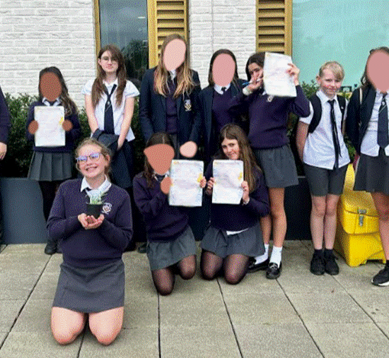 Students posing for photo outside of the University of Brighton