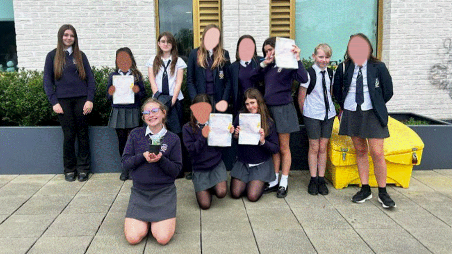 Students posing for photo outside of the University of Brighton