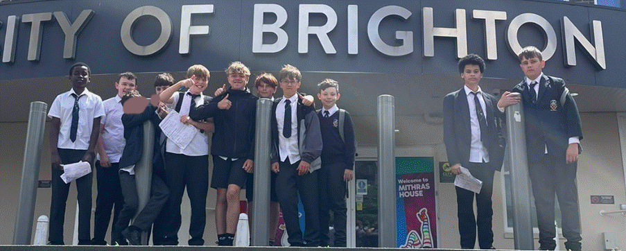 Students posing for photo outside of the University of Brighton