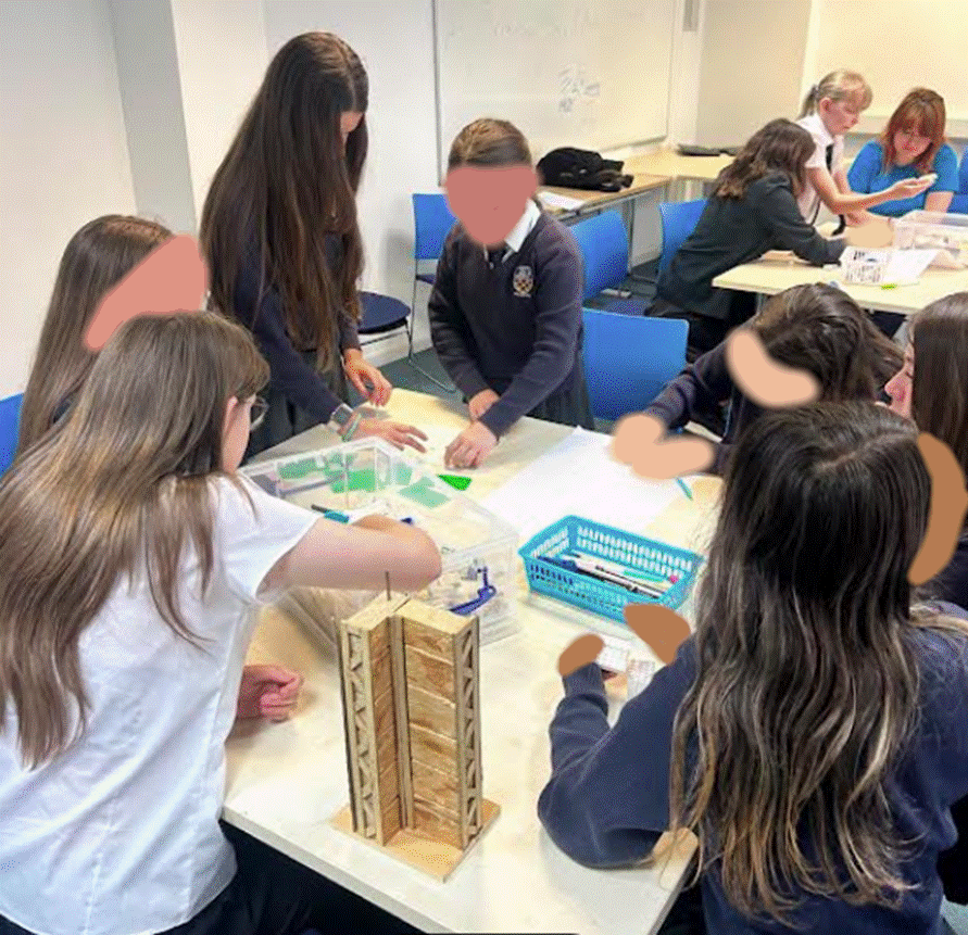 Students participating in workshop in a class room at the University of Brighton