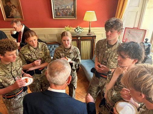 Cadets speaking to representative after the service