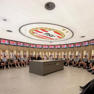 Students in the changing room of PSV Eindhoven Football Club