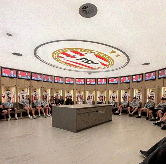 Students in the changing room of PSV Eindhoven Football Club