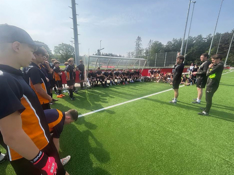 Students receiving coaching at the PSV Eindhoven training ground.